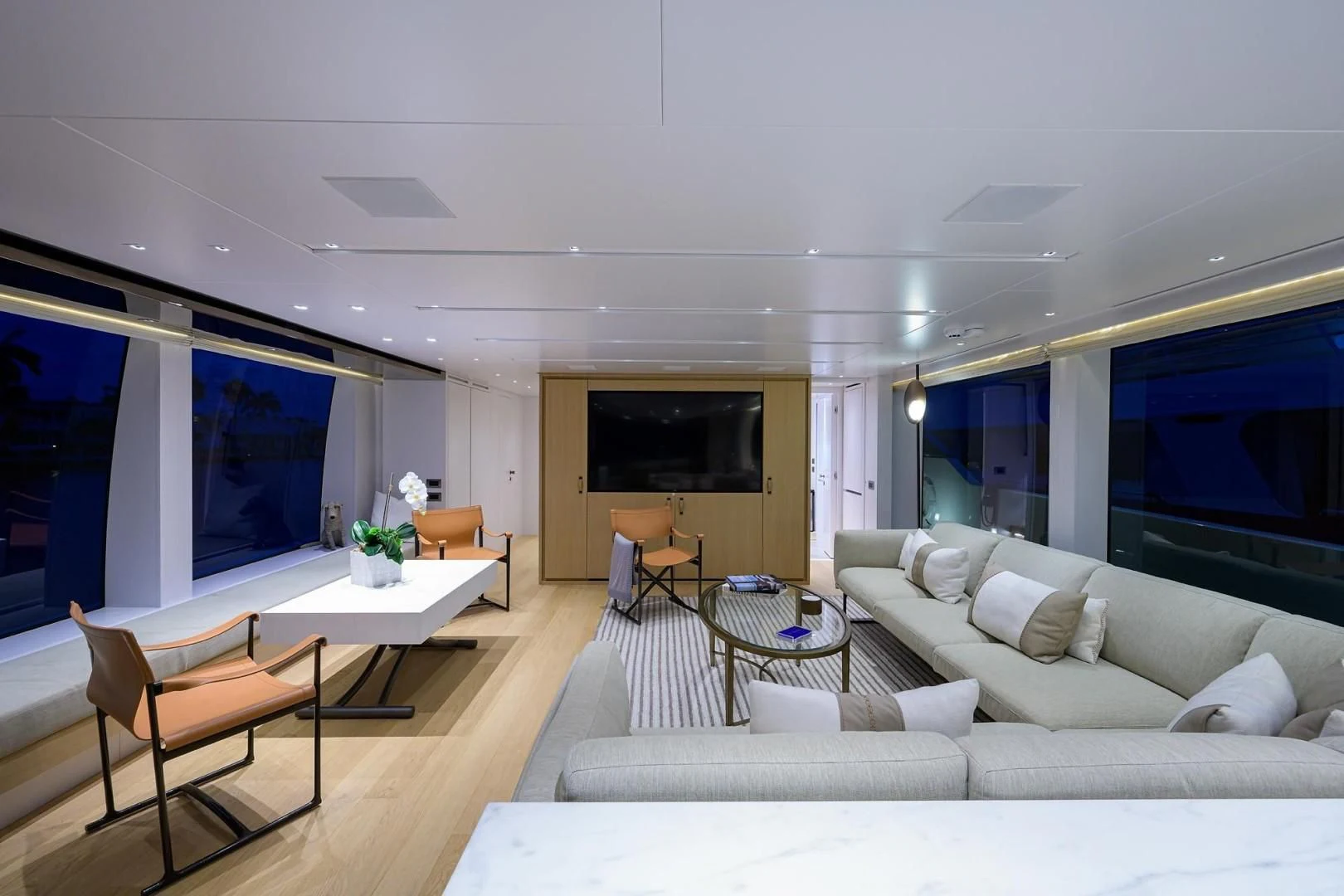 a living room with a large window aboard GATSBY Yacht for Charter