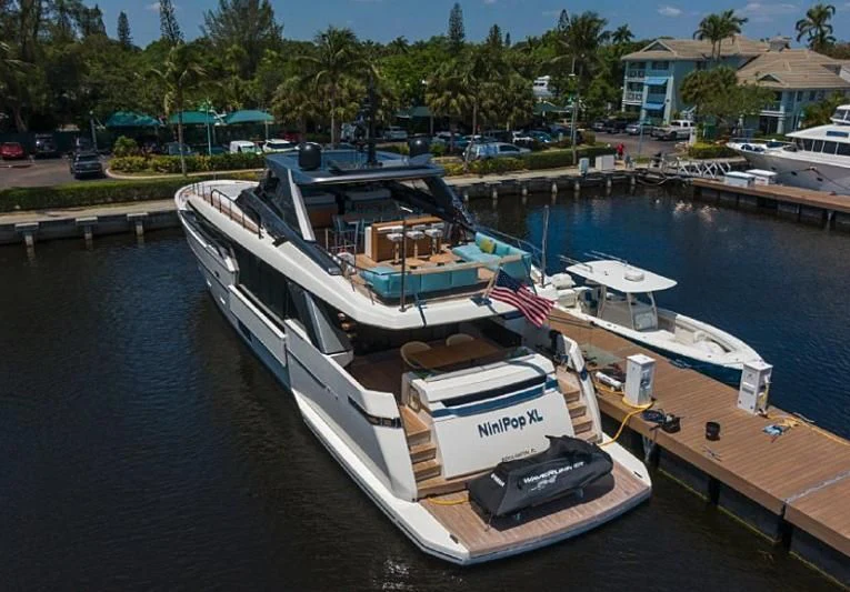 a boat docked at a pier aboard GATSBY Yacht for Charter
