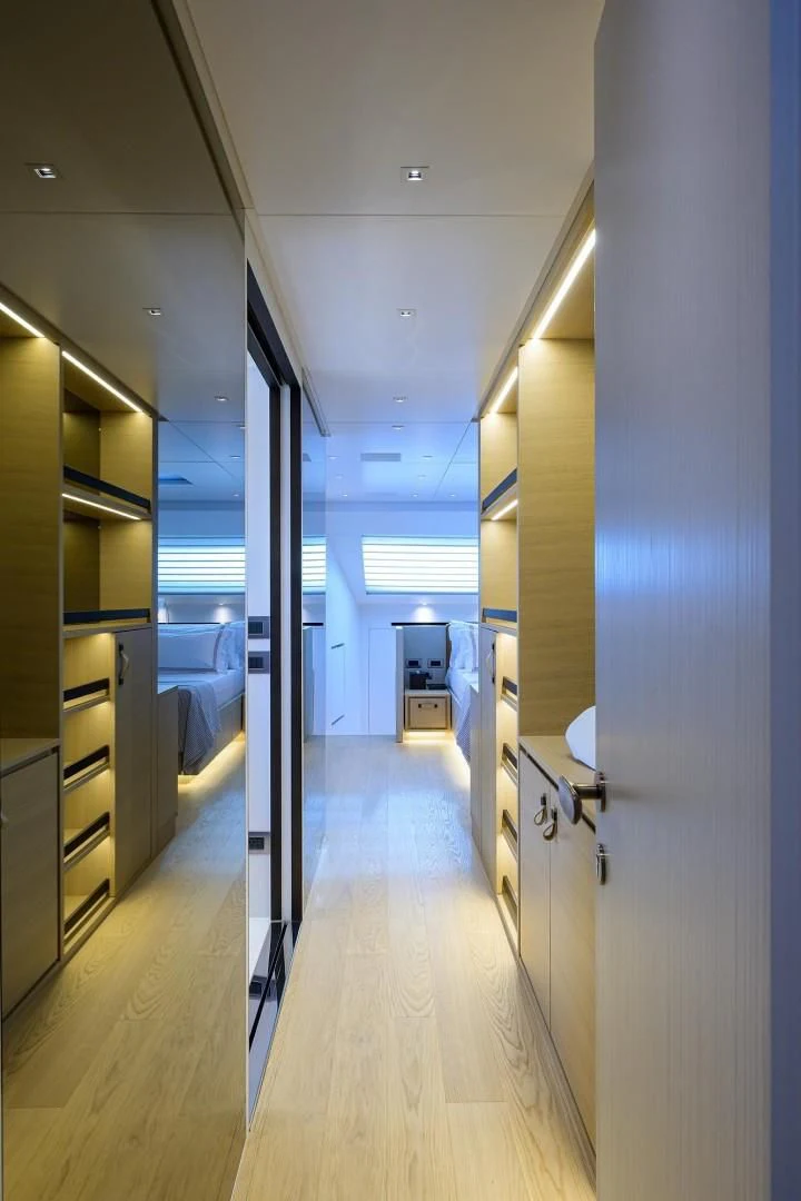 a hallway with cabinets and a door aboard GATSBY Yacht for Charter
