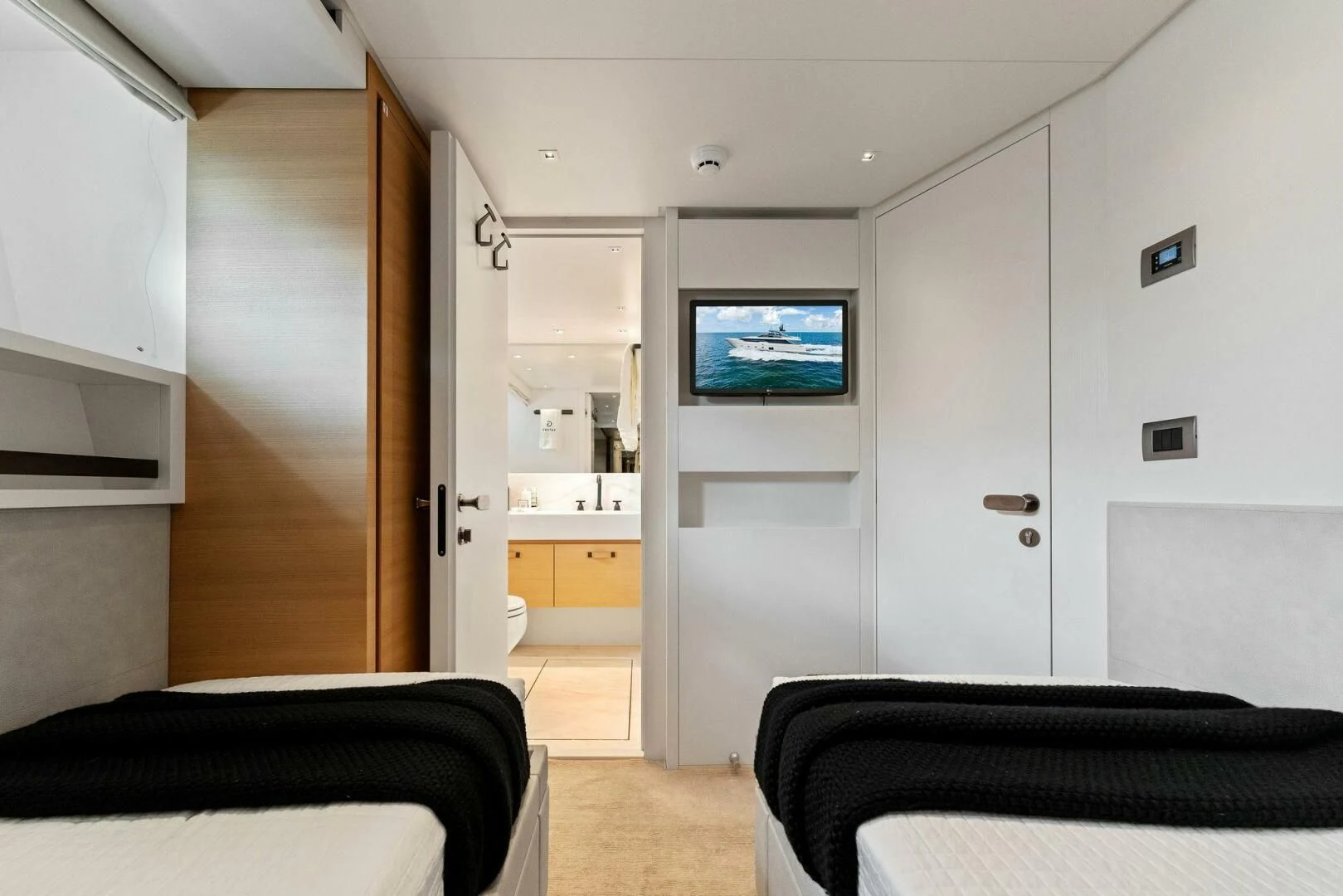 a bedroom with a tv aboard GATSBY Yacht for Charter
