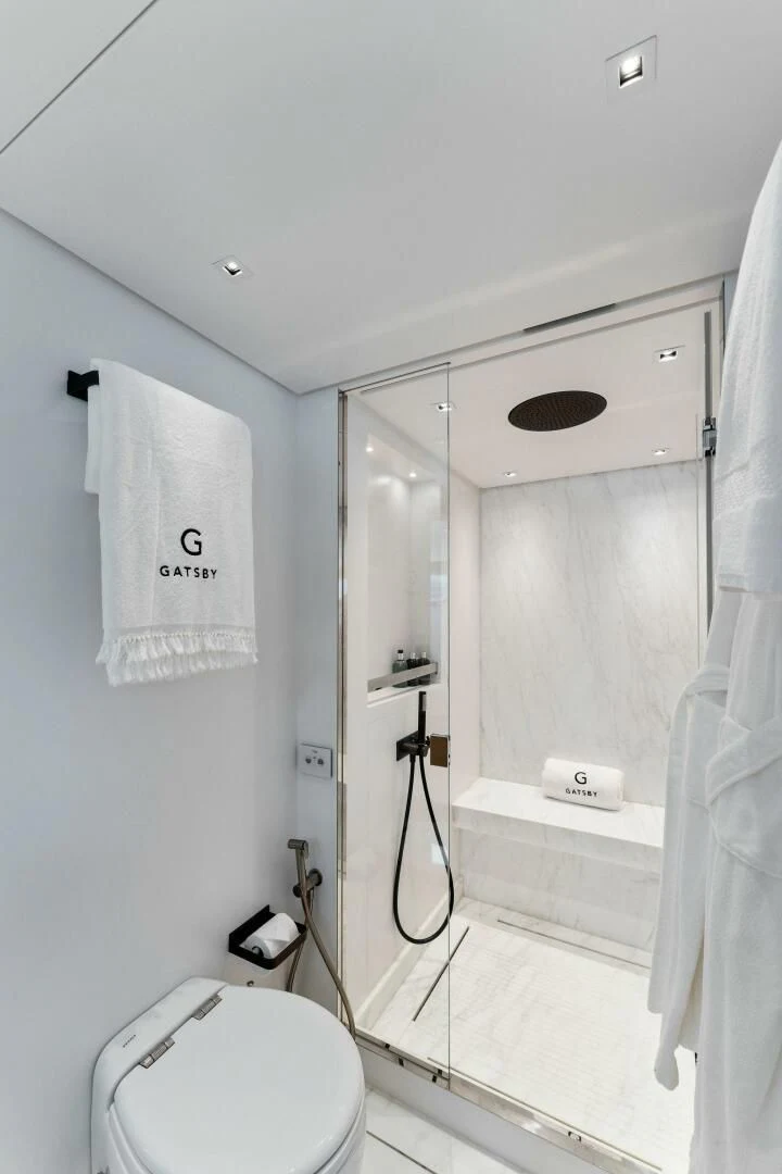 a bathroom with a shower unit aboard GATSBY Yacht for Charter