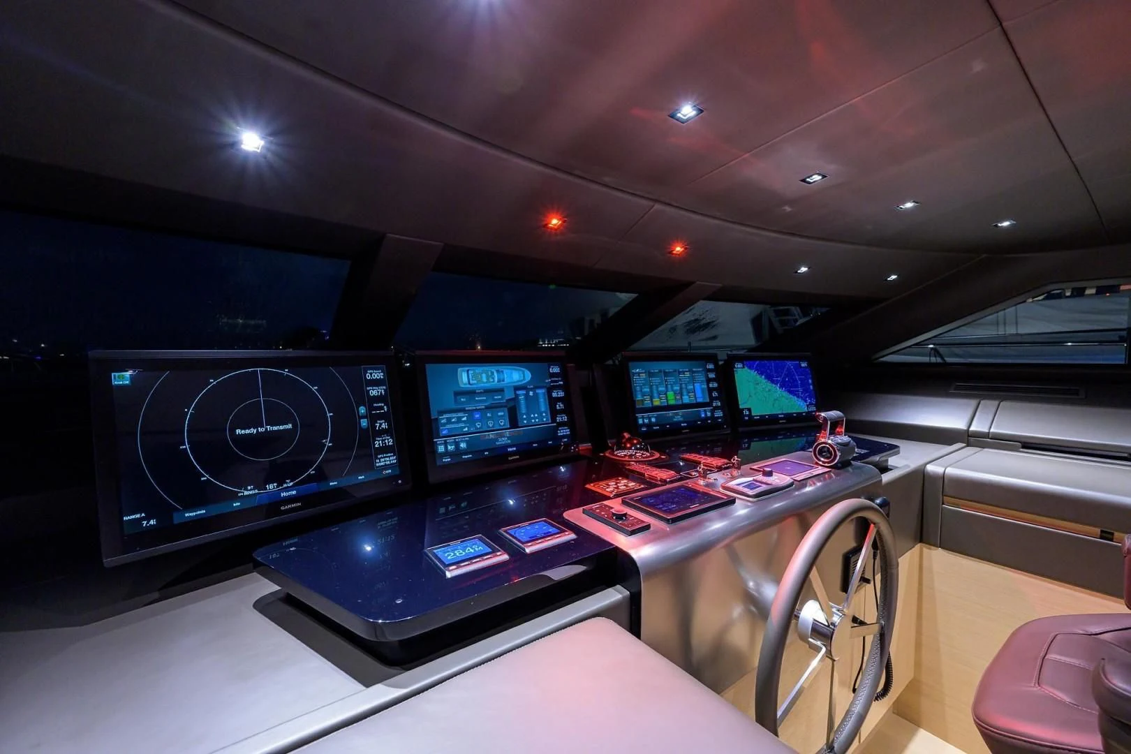 a control room with many monitors aboard GATSBY Yacht for Charter