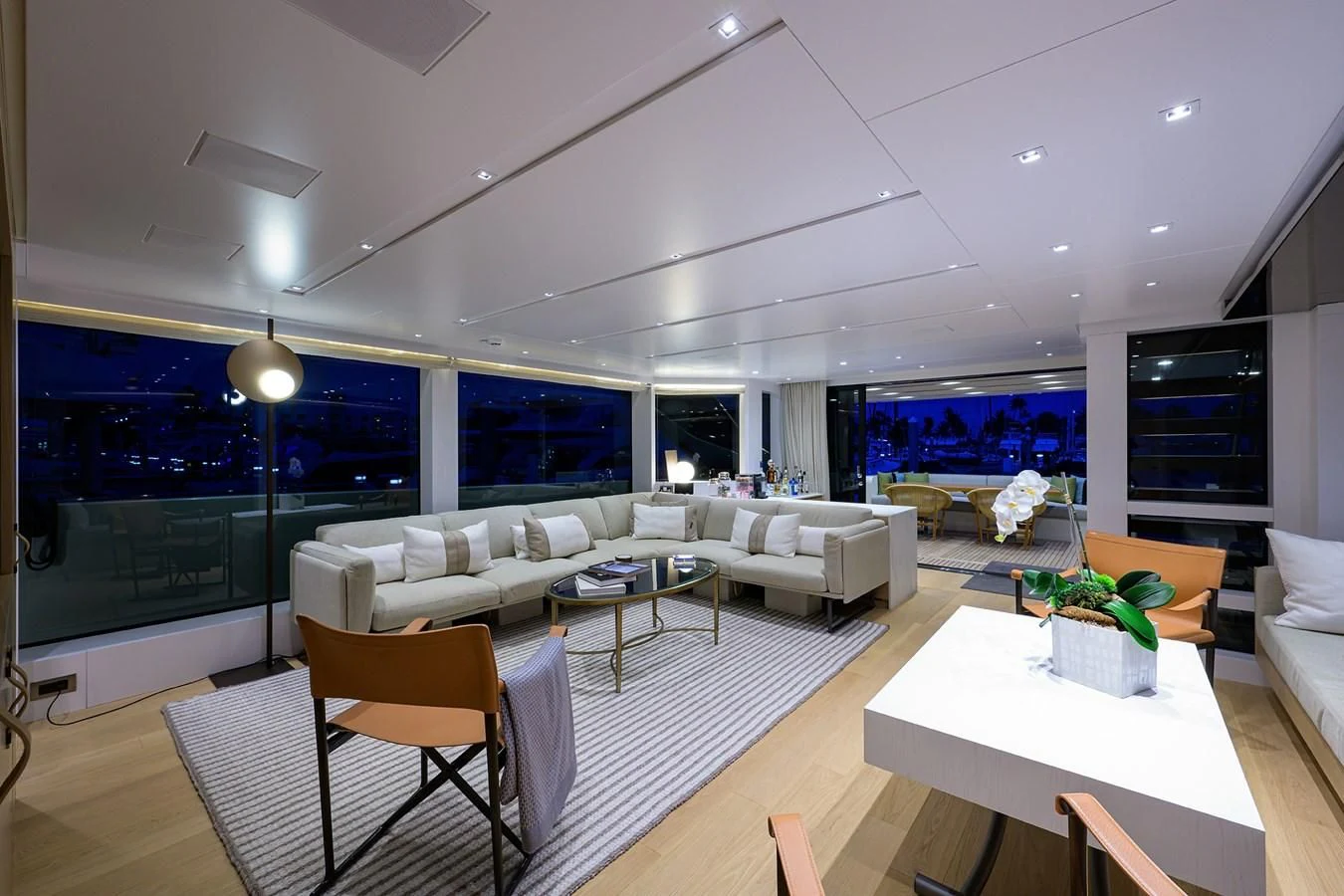 a living room with a large window aboard GATSBY Yacht for Charter