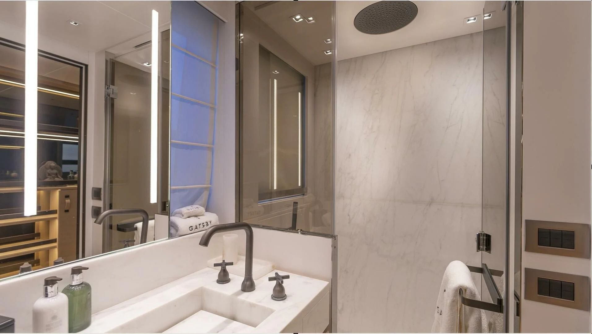 a bathroom with a large mirror aboard GATSBY Yacht for Charter