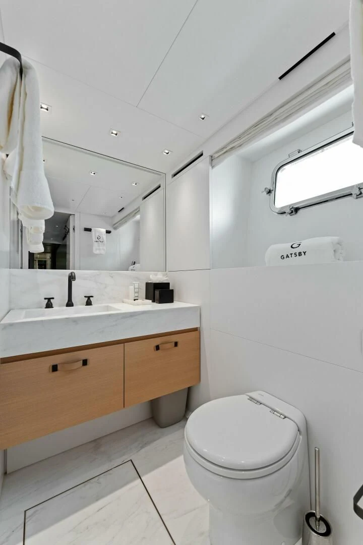 a bathroom with a toilet and a sink aboard GATSBY Yacht for Charter
