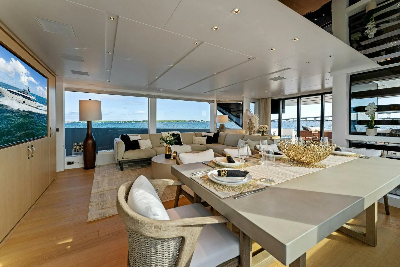 a living room with a large window aboard GATSBY Yacht for Charter