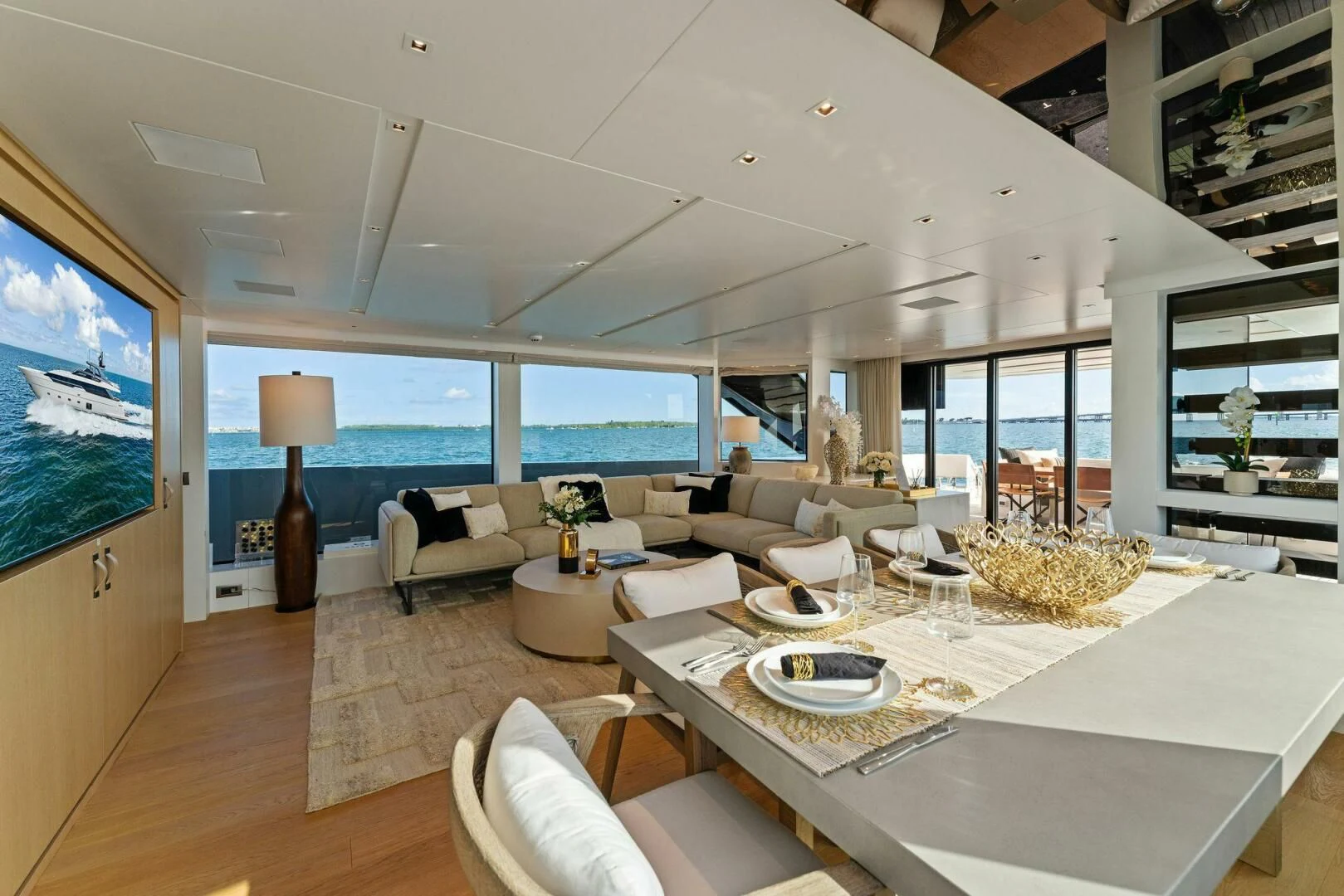 a modern living room with a large window aboard GATSBY Yacht for Charter
