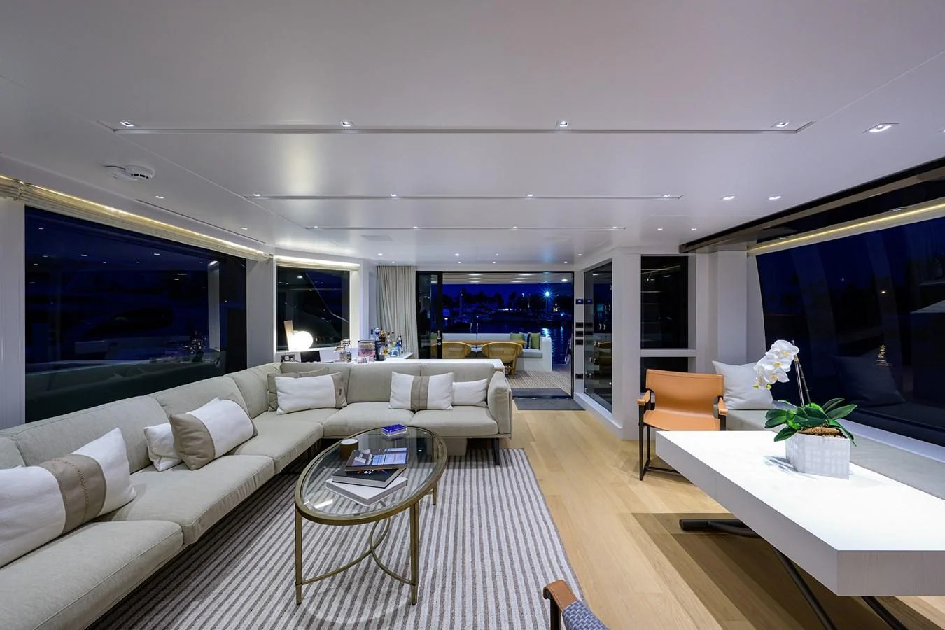a living room with a large window aboard GATSBY Yacht for Charter