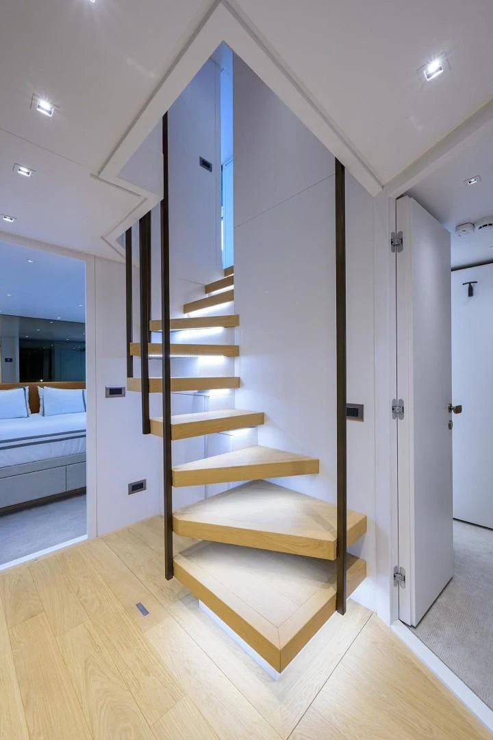 a wooden staircase in a room aboard GATSBY Yacht for Charter