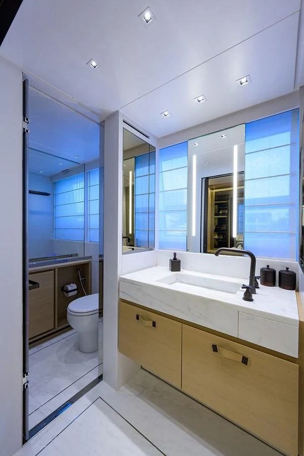 a bathroom with a large mirror aboard GATSBY Yacht for Charter