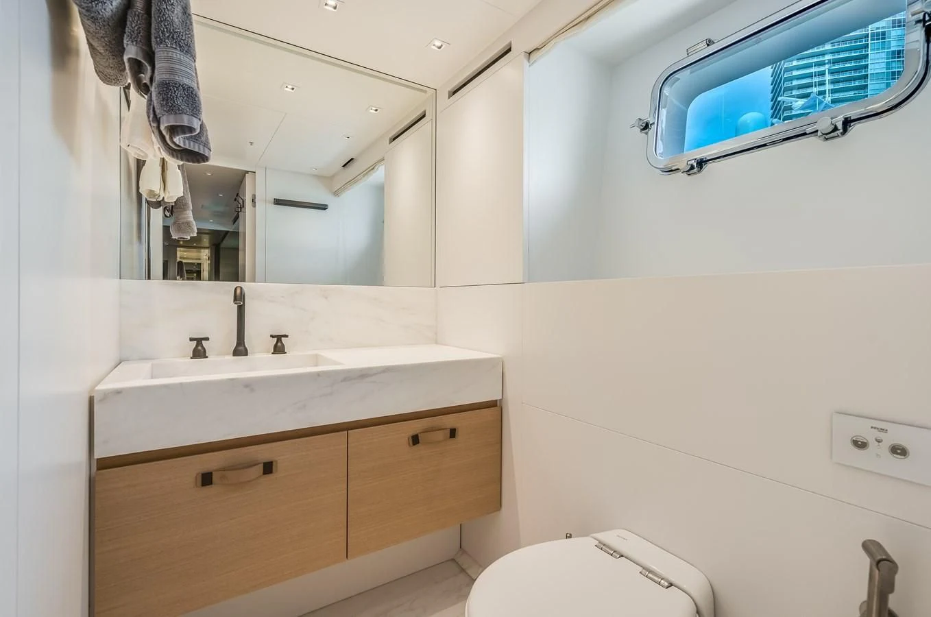 a bathroom with a large mirror aboard GATSBY Yacht for Charter