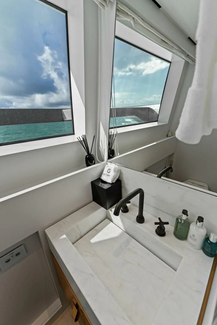 a bathroom with a large window aboard GATSBY Yacht for Charter