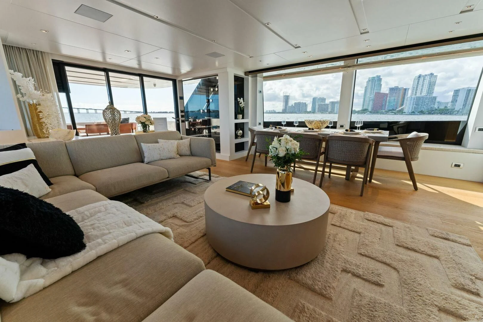 a living room with a large window aboard GATSBY Yacht for Charter