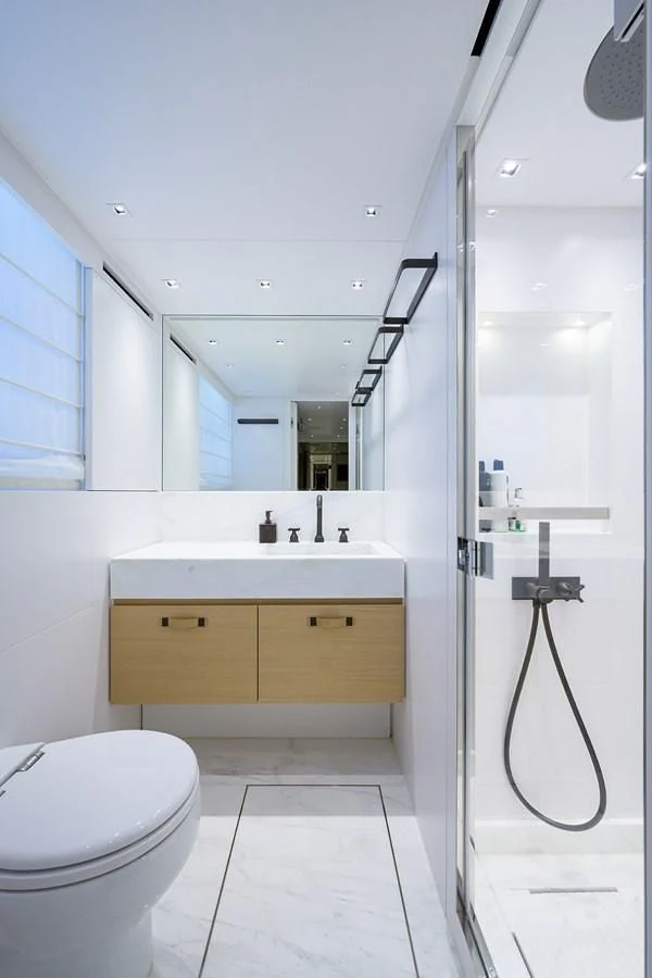 a bathroom with a sink and a toilet aboard GATSBY Yacht for Charter