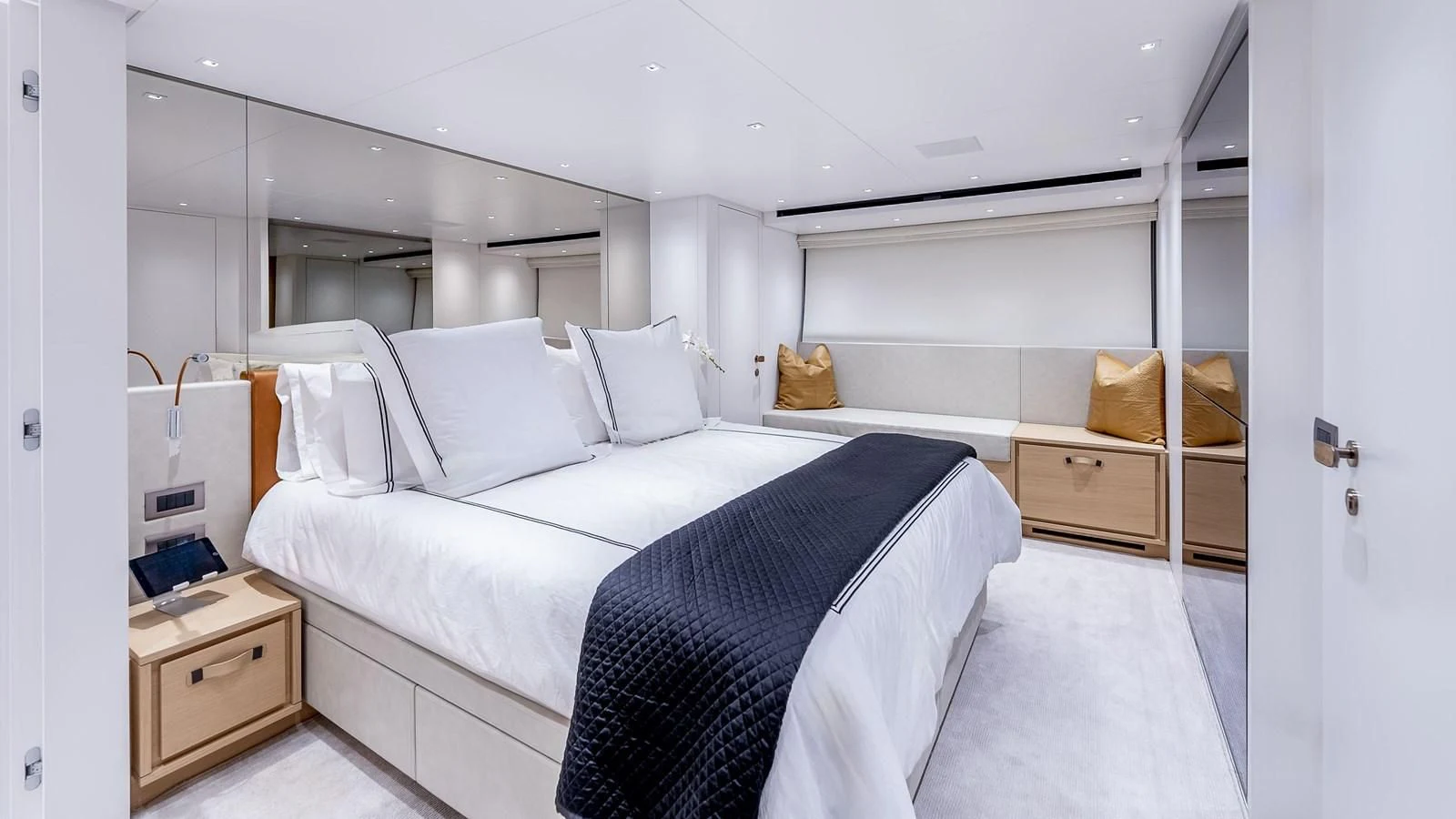 a room with a bed and a desk aboard GATSBY Yacht for Charter