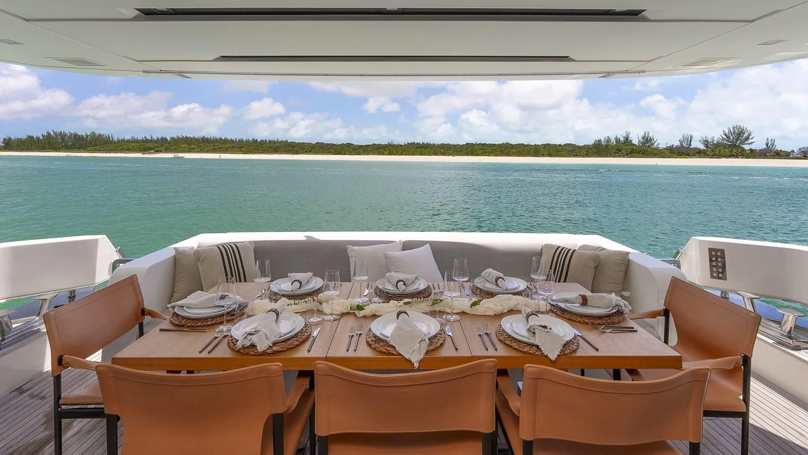 a table set for a meal on a boat aboard GATSBY Yacht for Charter