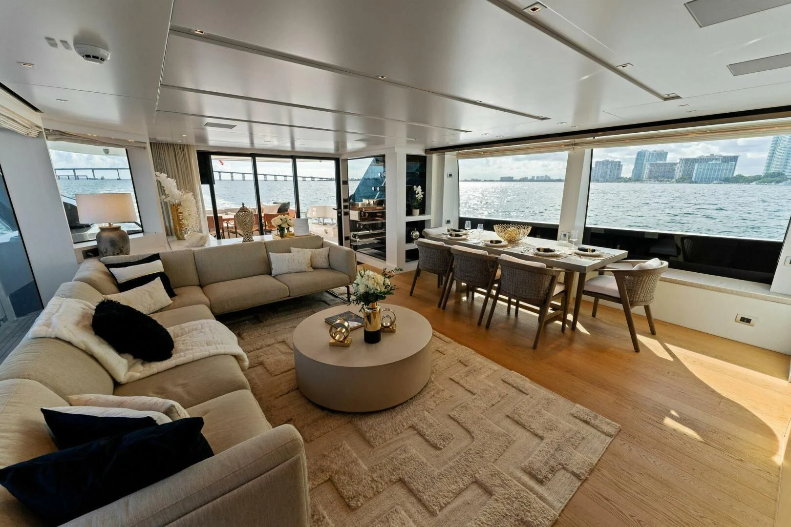 a living room with a large window aboard GATSBY Yacht for Charter