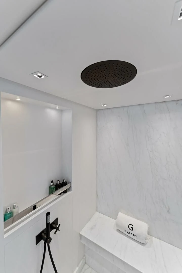 a white wall with a circle on it aboard GATSBY Yacht for Charter