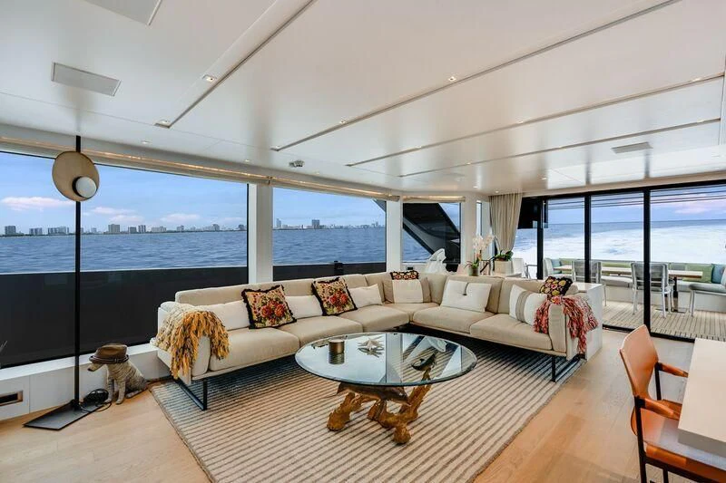 a living room with a large window aboard GATSBY Yacht for Charter