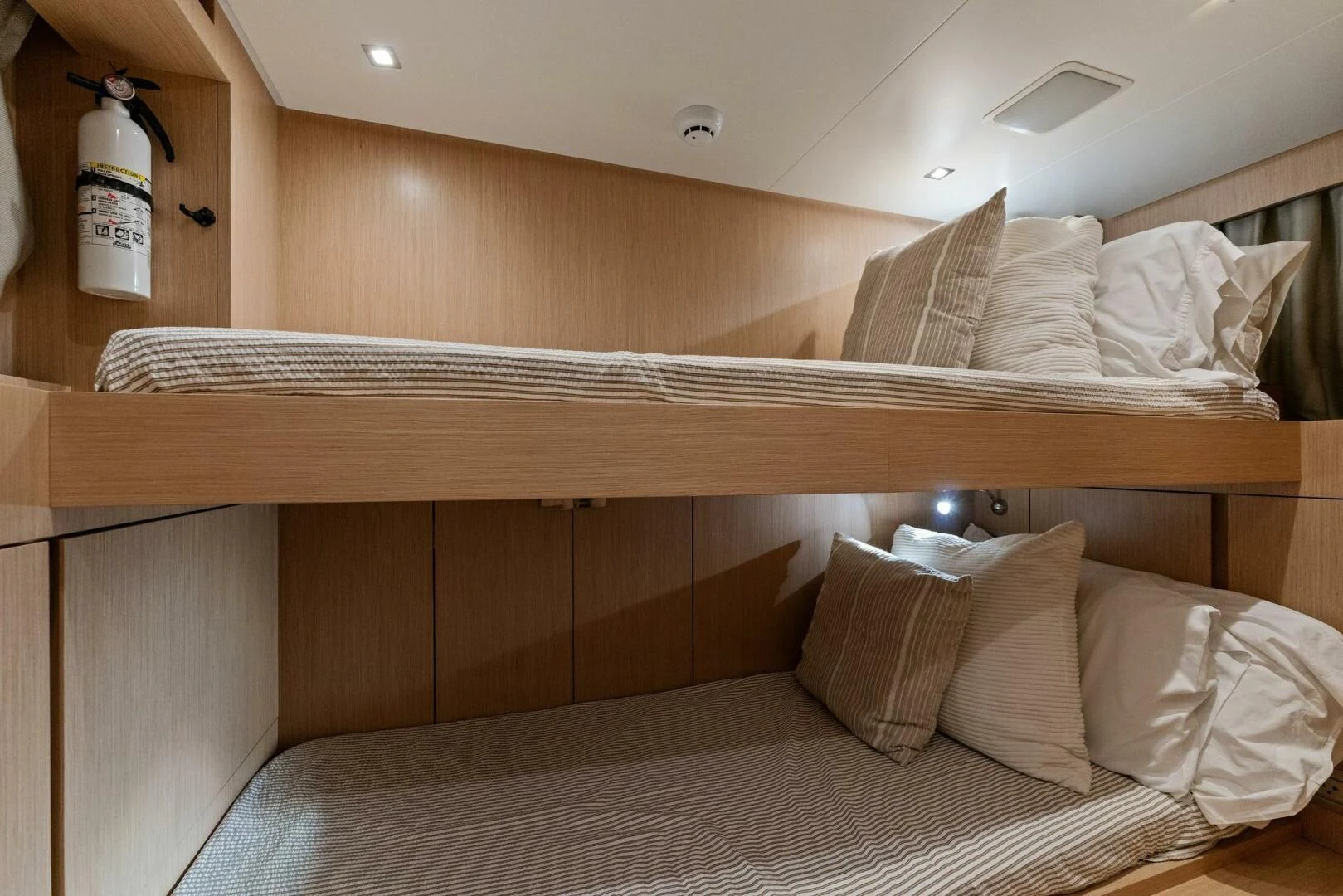 a bed with white sheets aboard GATSBY Yacht for Charter