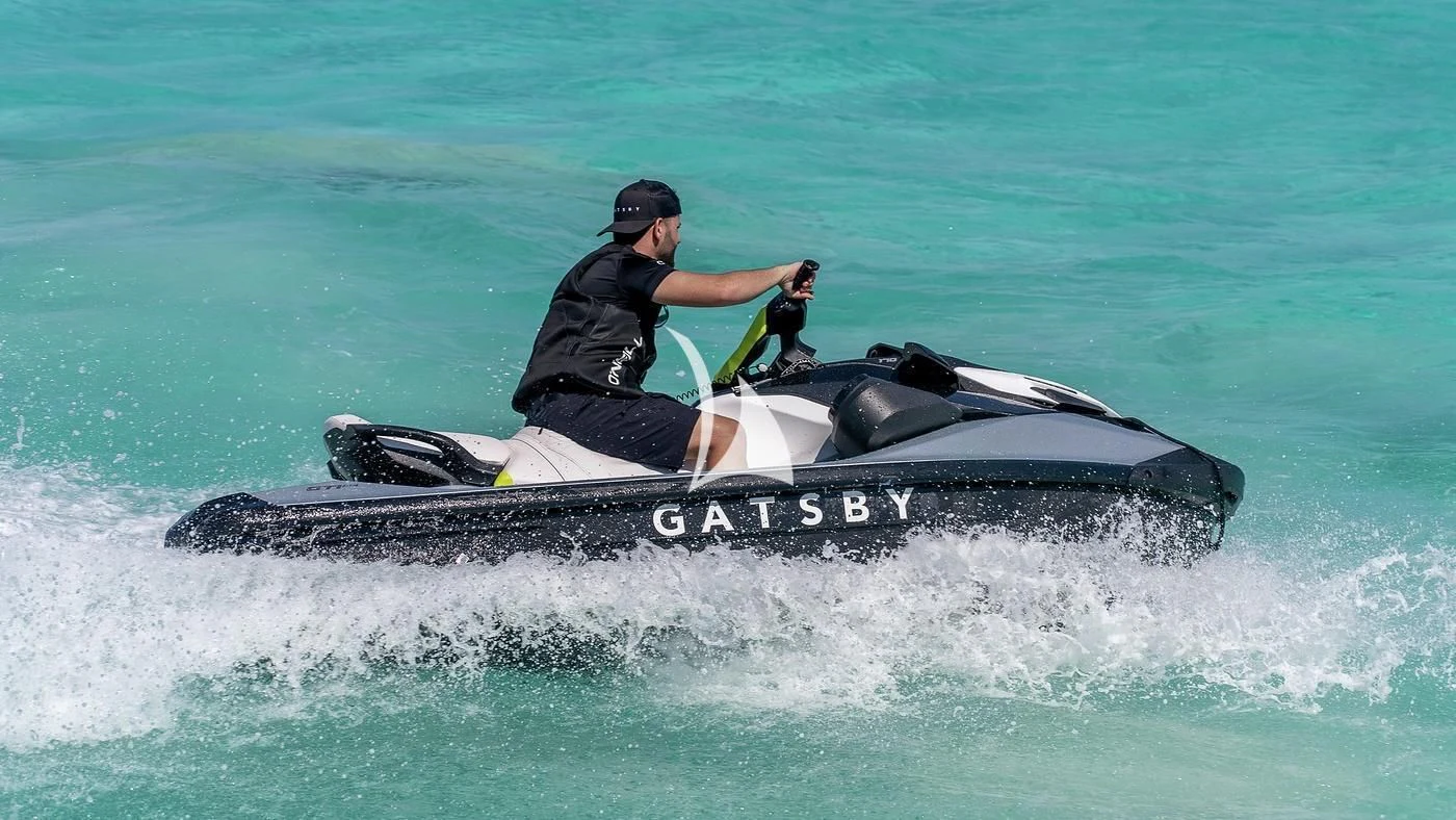 a man riding a jet ski aboard GATSBY Yacht for Charter