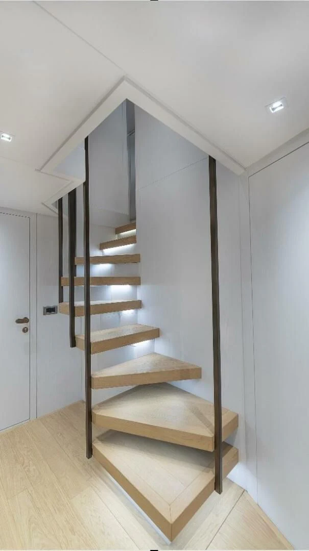 a wooden staircase in a house aboard GATSBY Yacht for Charter