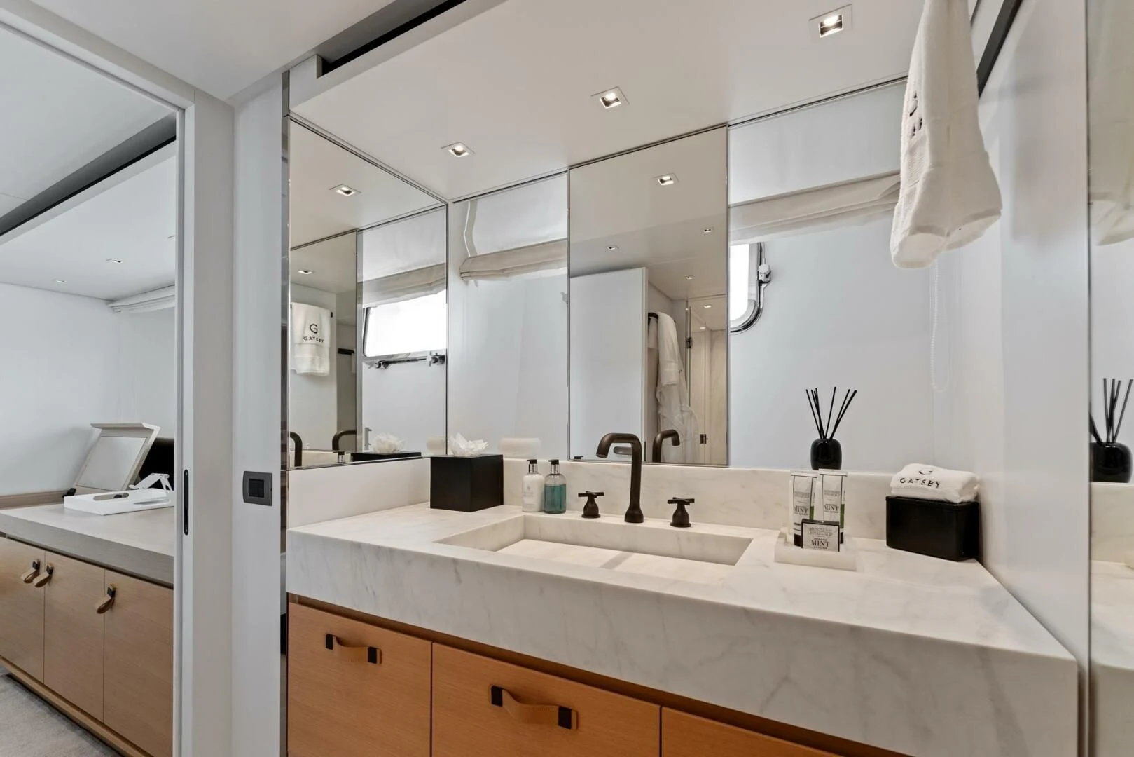 a bathroom with a large mirror aboard GATSBY Yacht for Charter