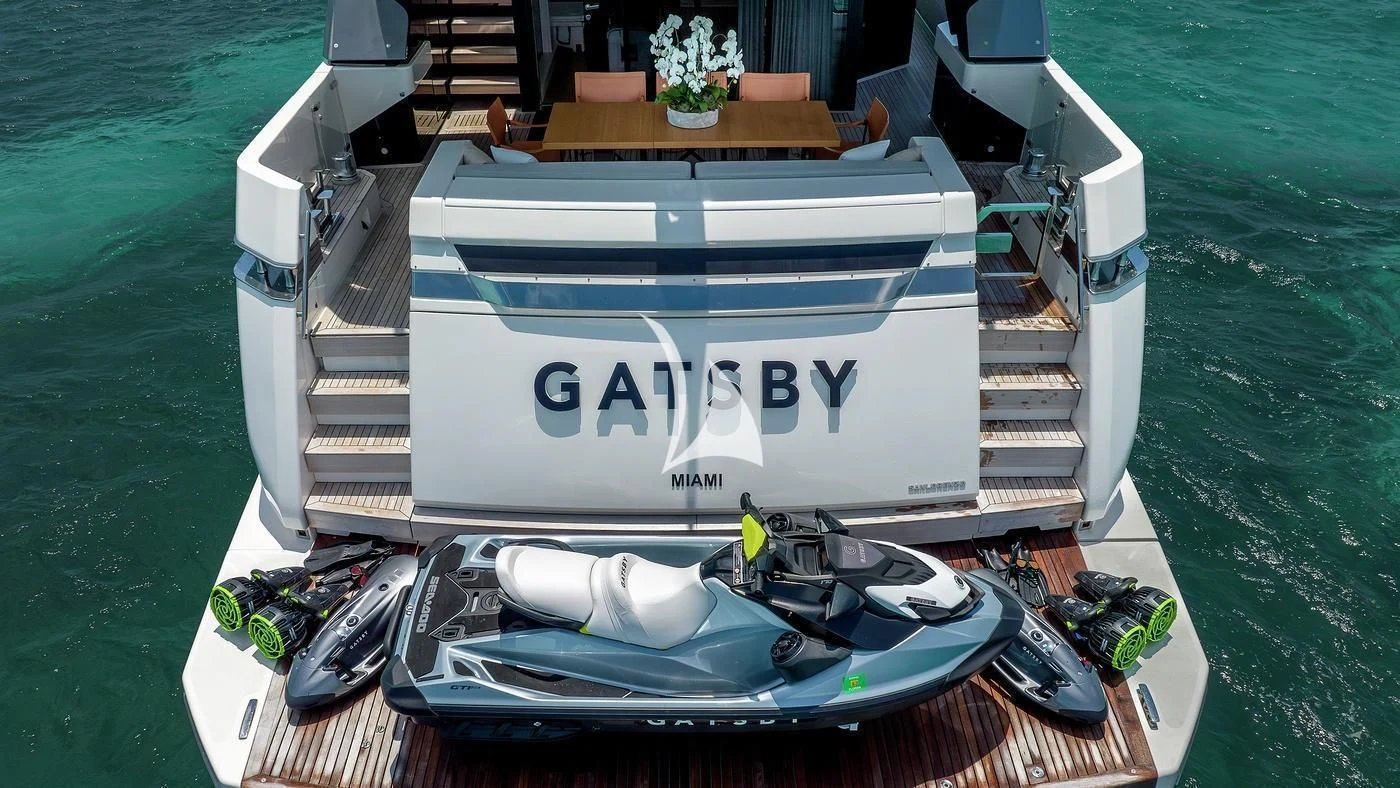a boat with a sign on the front aboard GATSBY Yacht for Charter