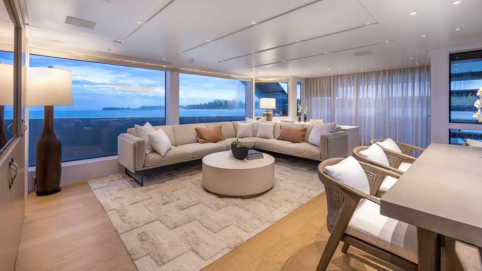 a living room with a large window aboard GATSBY Yacht for Charter