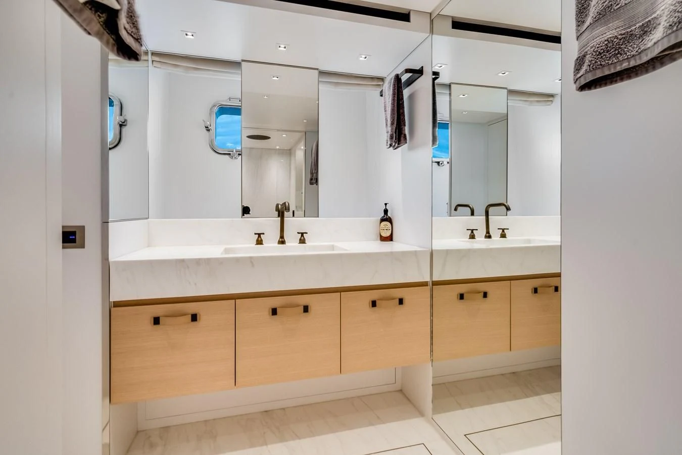 a bathroom with a large mirror aboard GATSBY Yacht for Charter