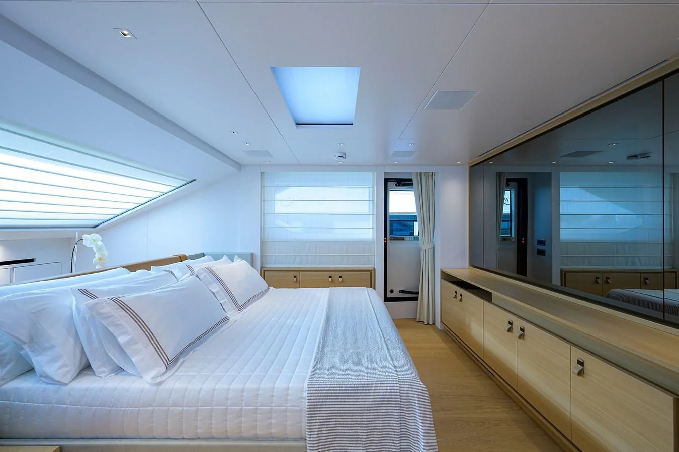 a bedroom with a large bed aboard GATSBY Yacht for Charter
