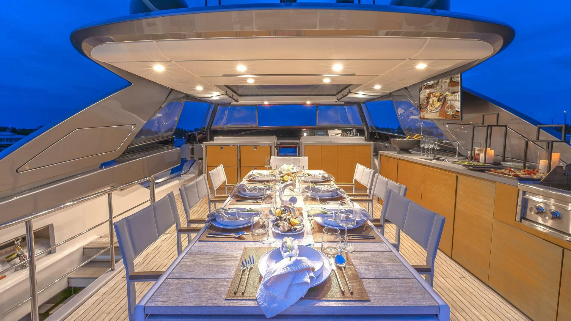 a large kitchen with a dining table aboard GATSBY Yacht for Charter