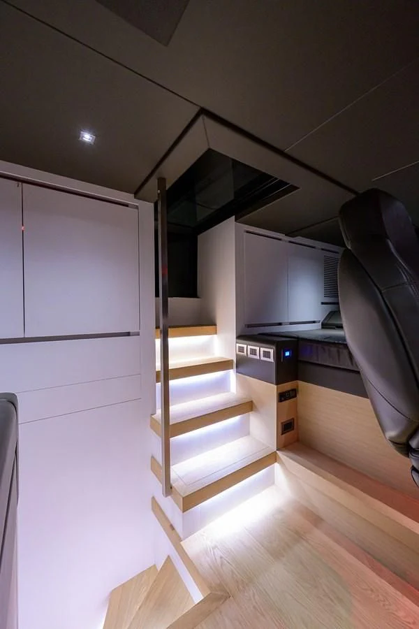 a room with a staircase and a shelf aboard GATSBY Yacht for Charter