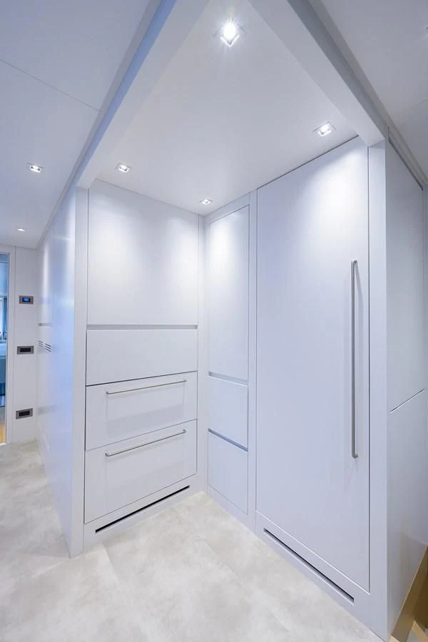 a room with white cabinets aboard GATSBY Yacht for Charter