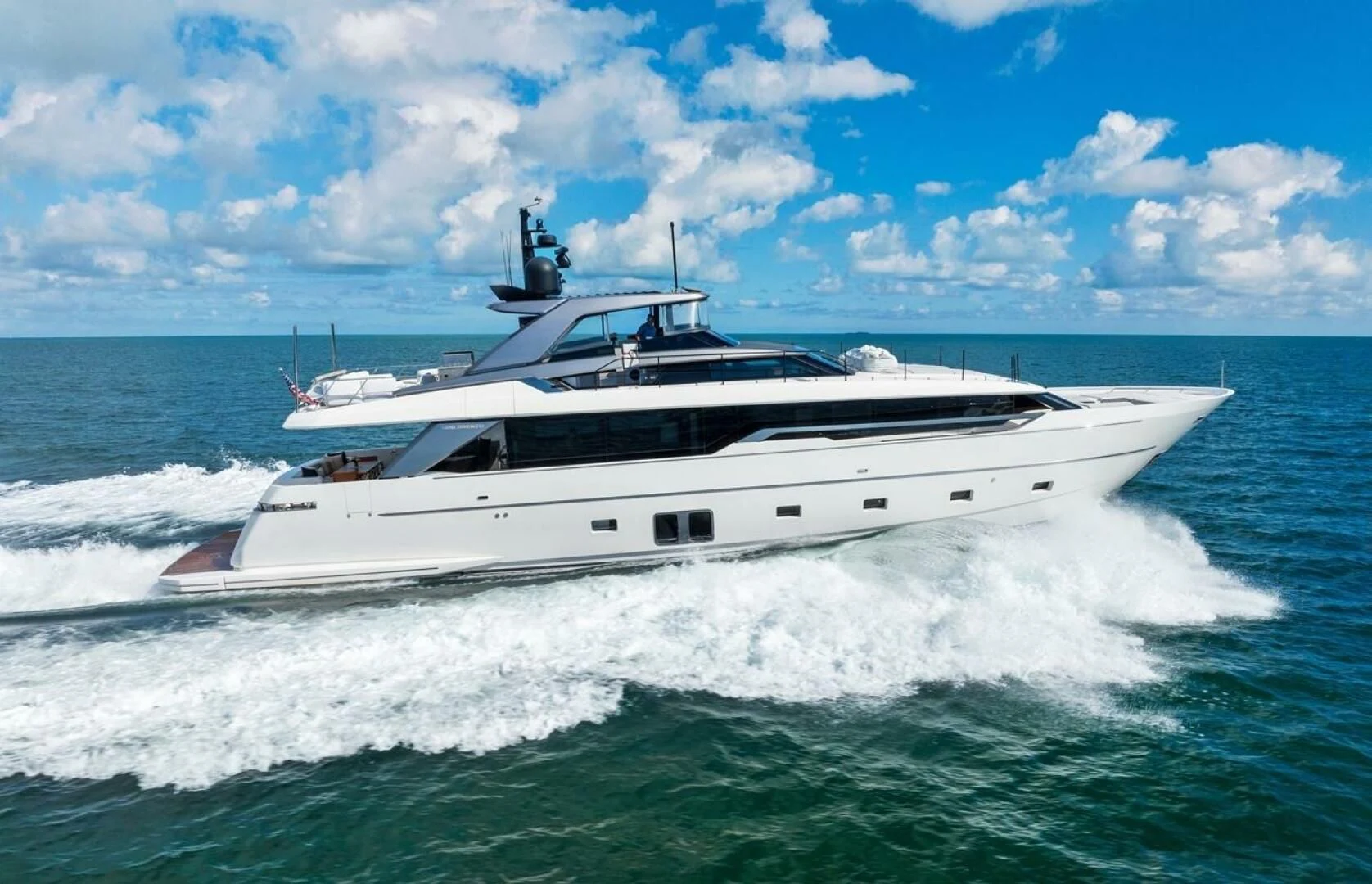 a white yacht on the water aboard GATSBY Yacht for Charter