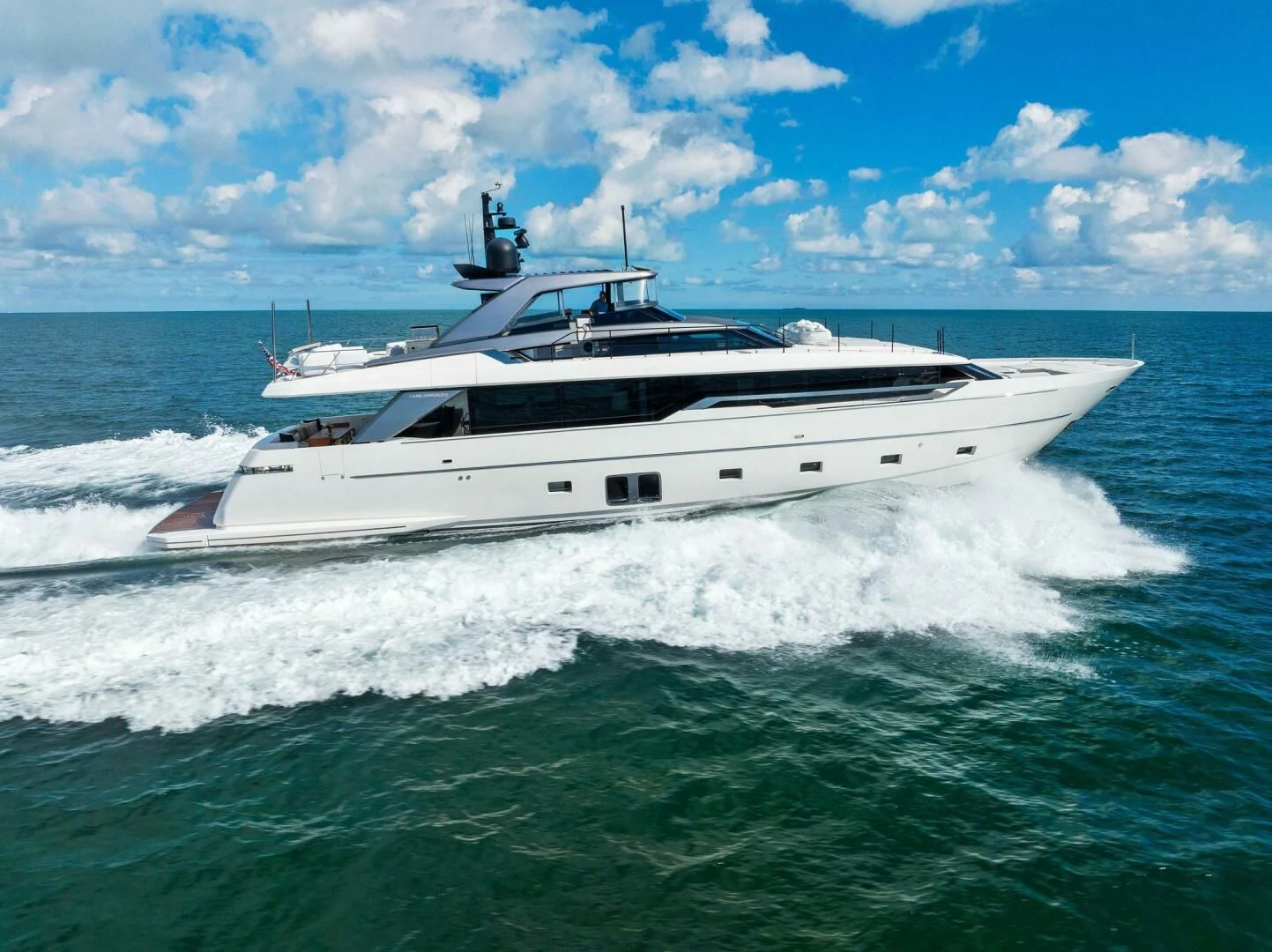 a white yacht on the water aboard GATSBY Yacht for Charter