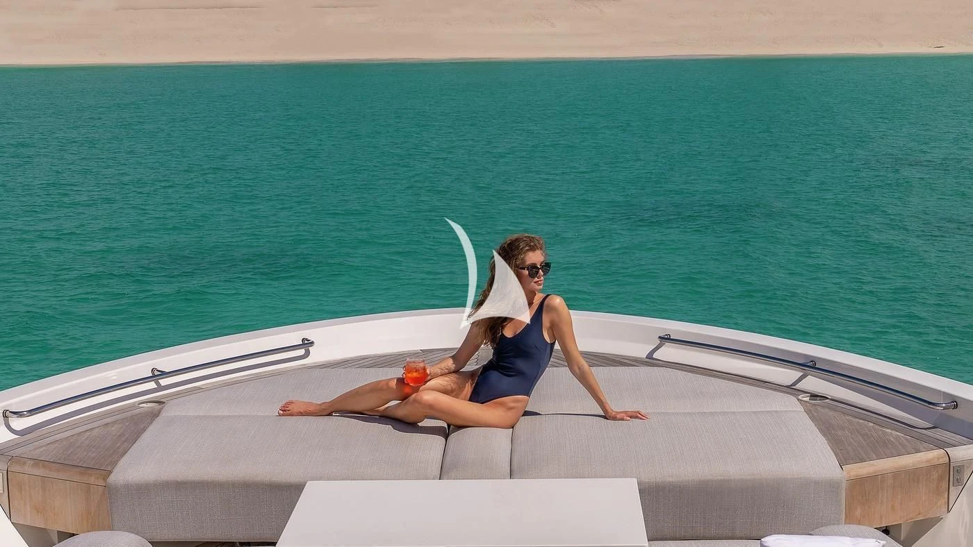 a person sitting on a boat aboard GATSBY Yacht for Charter