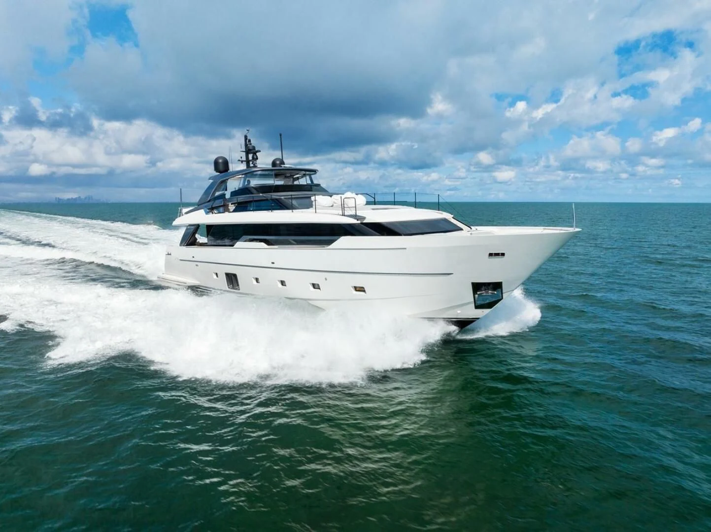 a white yacht on the water aboard GATSBY Yacht for Charter