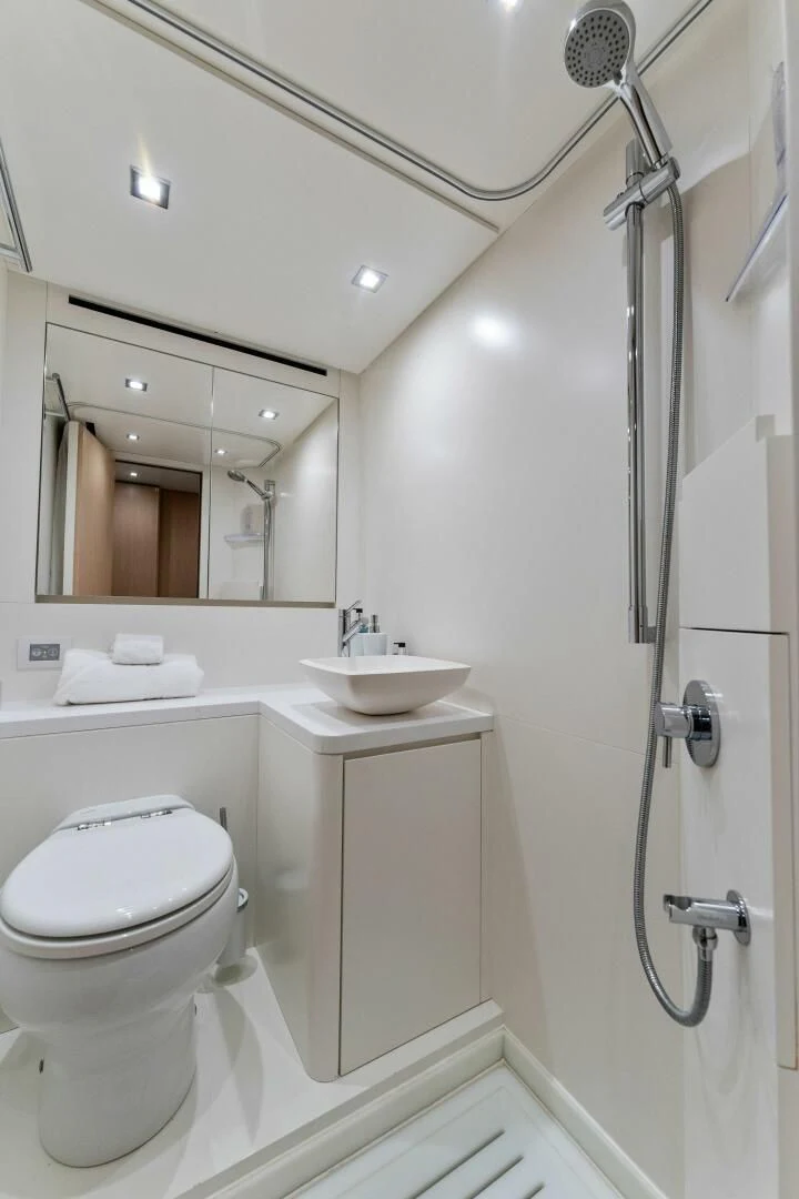 a bathroom with a toilet and sink aboard GATSBY Yacht for Charter