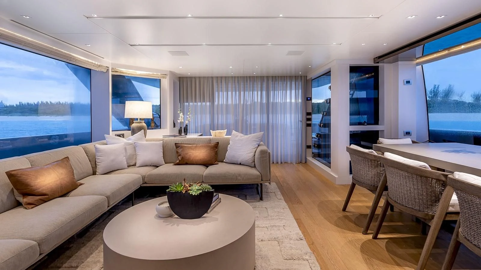 a living room with a large window aboard GATSBY Yacht for Charter