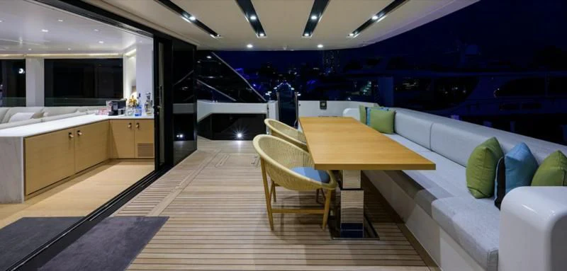 a room with a table and chairs aboard GATSBY Yacht for Charter