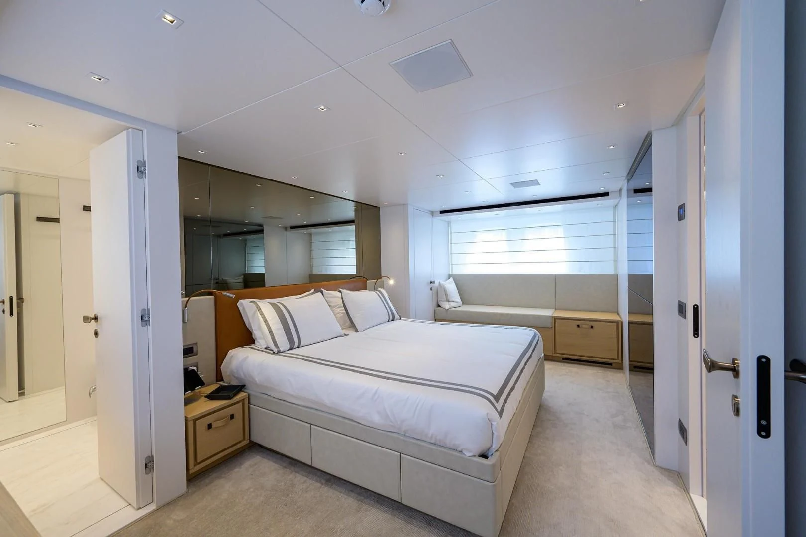 a bedroom with a bed aboard GATSBY Yacht for Charter