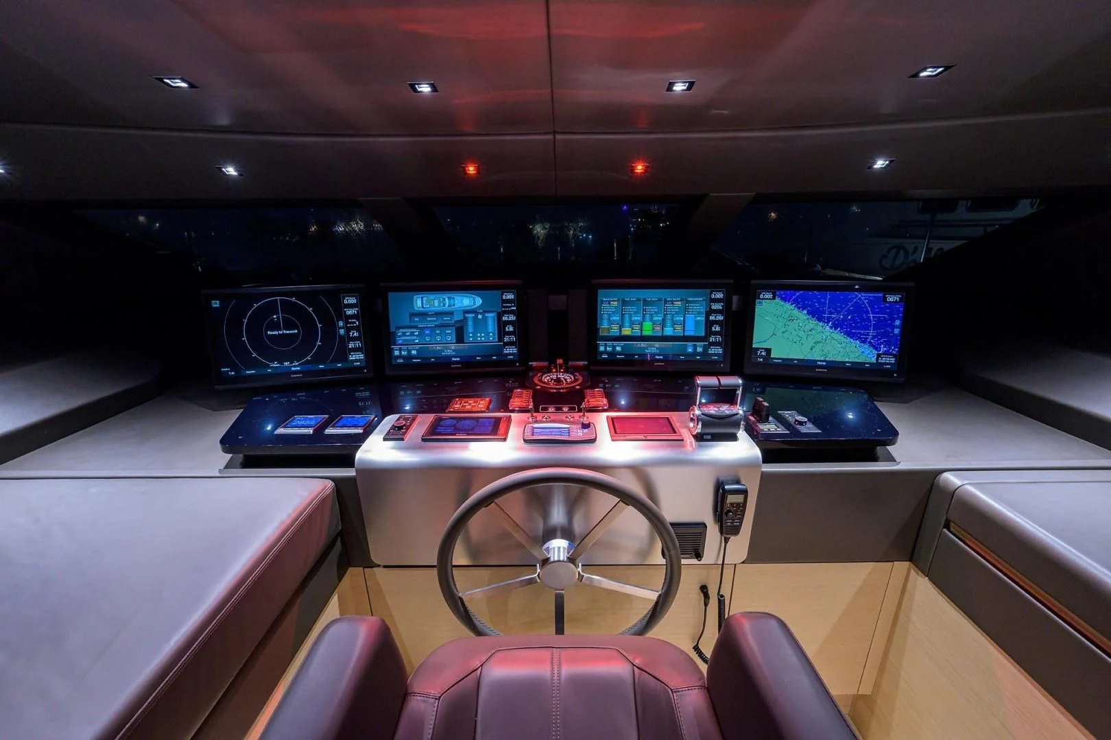 a room with many monitors and a chair aboard GATSBY Yacht for Charter