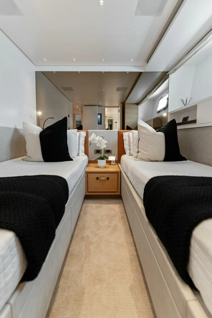 a bedroom with two beds aboard GATSBY Yacht for Charter