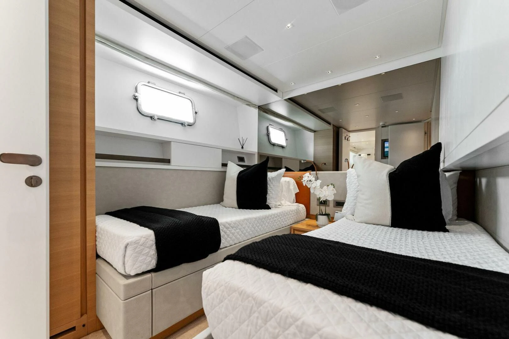 a couple of beds in a room aboard GATSBY Yacht for Charter