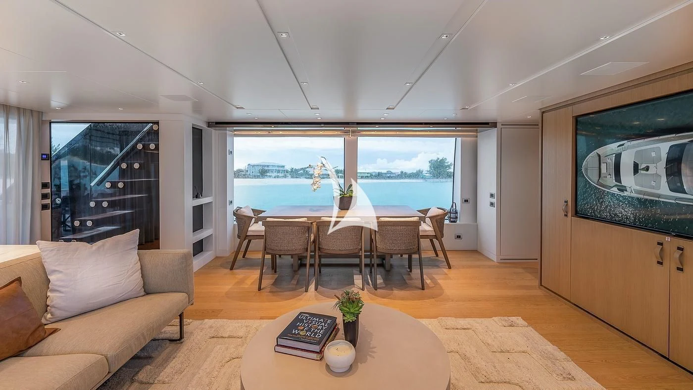 a living room with a table and chairs aboard GATSBY Yacht for Charter