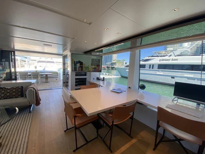 a room with a table and chairs aboard GATSBY Yacht for Charter