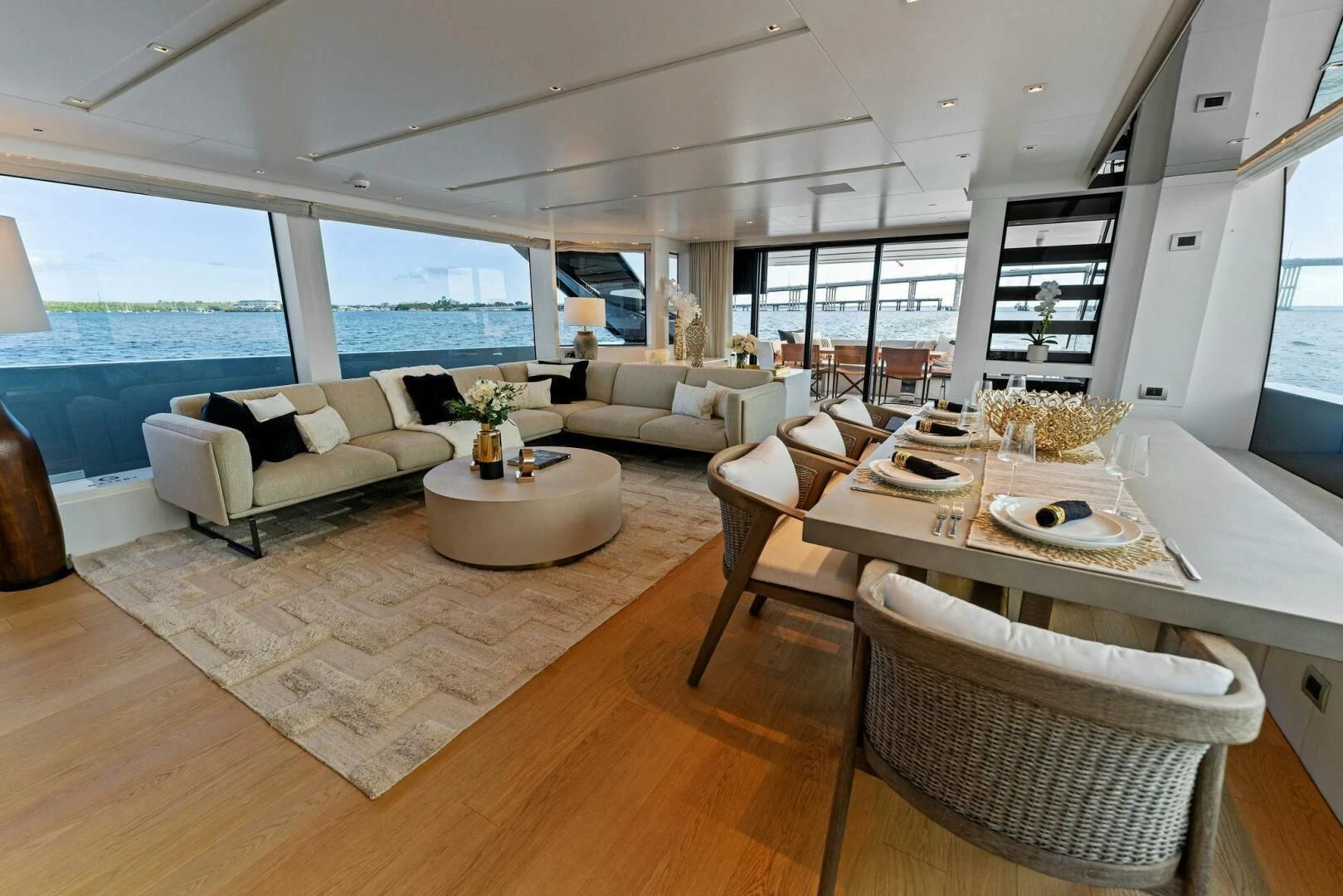 a living room with a large window aboard GATSBY Yacht for Charter