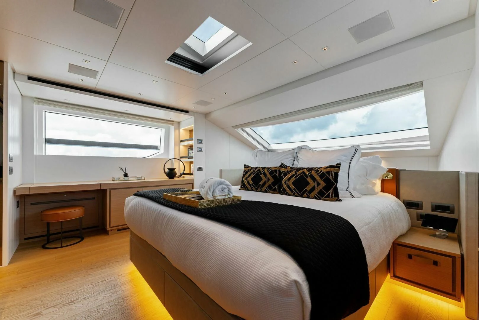 a bedroom with a large bed aboard GATSBY Yacht for Charter