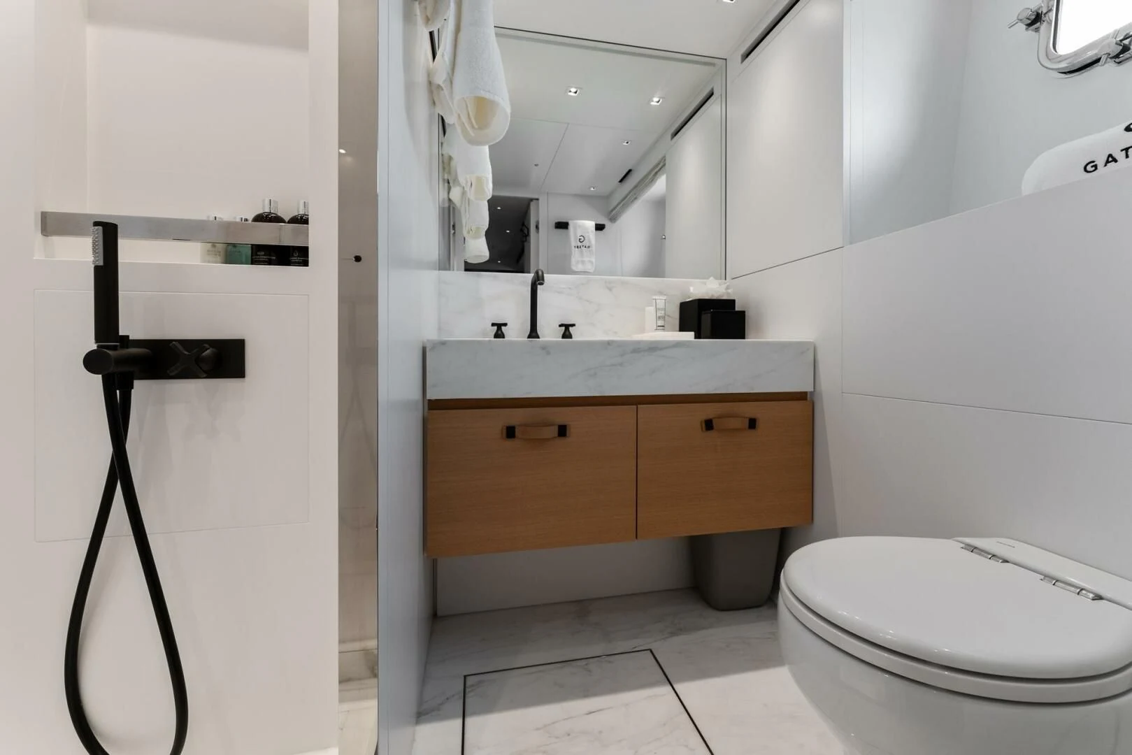 a bathroom with a toilet and a sink aboard GATSBY Yacht for Charter